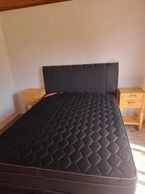 a bed in the corner of a room at CASA ANTONIA in Embalse