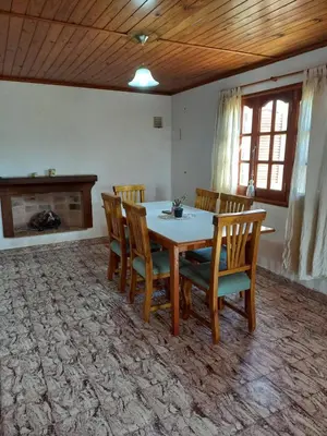 a dining room with a table and chairs at CASA ANTONIA in Embalse