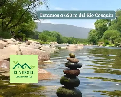 a stack of rocks in the water next to a river at El Vergel in Santa María