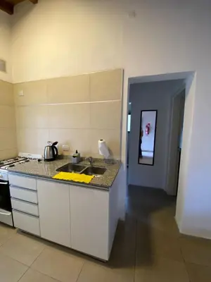 a kitchen with a sink and a counter top at Villa Simona in Santa Rosa de Calamuchita