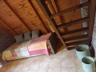 an overhead view of a bed in a attic at Alpinas La Linda in Villa General Belgrano