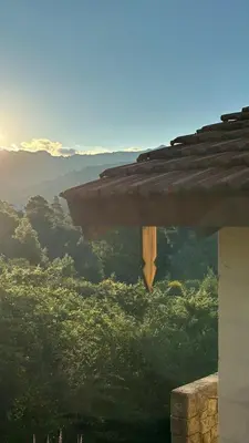 a view of the mountains from a roof at Casa La Boticaria in La Cumbrecita