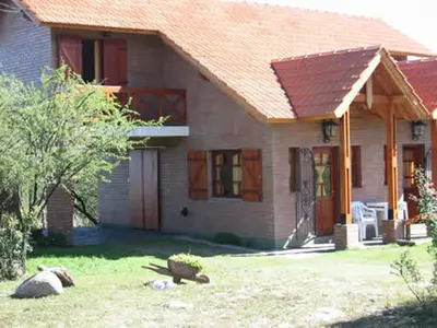 a small house with a red roof at Cabañas Oma Lissi in Merlo