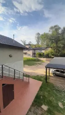 a car parked in a parking lot next to a house at Tantanakuy 2 in Villa General Belgrano