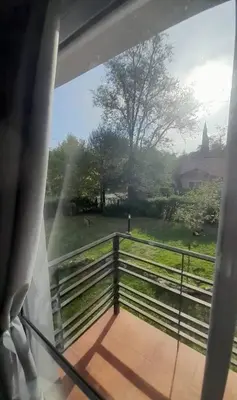 a view of a fence and a field from a balcony at Tantanakuy 2 in Villa General Belgrano