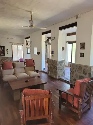a living room with a couch and a table at Casona y Casa de Campo in Santa María
