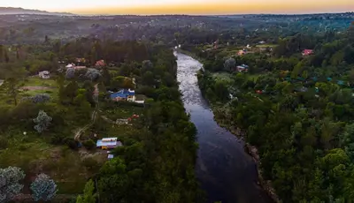 an aerial view of a river with houses and trees at Hospedaje Frente al Rio el Rancho in Santa Rosa de Calamuchita