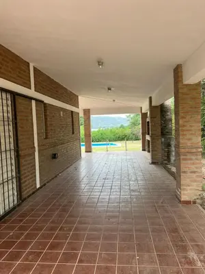 an empty hallway of a building with a tile floor at Casa en Potrero de Garay in Potrero de Garay