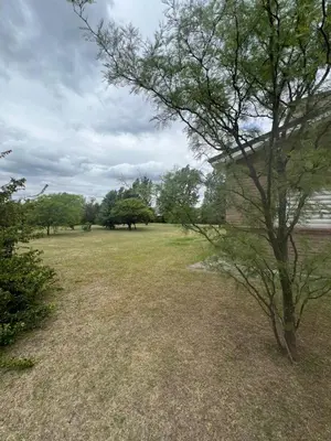 a large field with trees and a building at Casa en Potrero de Garay in Potrero de Garay