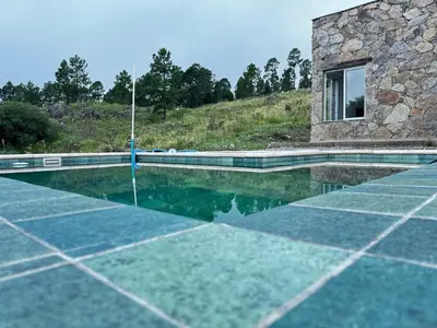 an image of a swimming pool in a house at El Sauce in La Cumbrecita