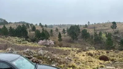 a car parked on the side of a hill at El Sauce in La Cumbrecita