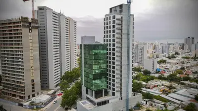 an aerial view of a city with tall buildings at Amérian Río Cuarto in Río Cuarto