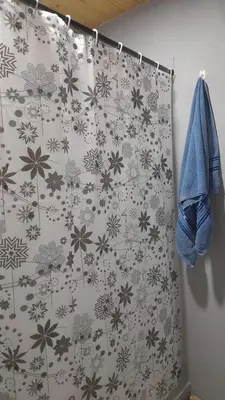 a shower curtain in a bathroom with flowers on it at Casa en Boca del Río in Las Tapias