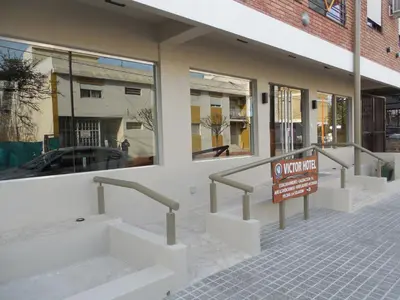 a building with a no parking sign in front of it at Victor Hotel in Villa Carlos Paz