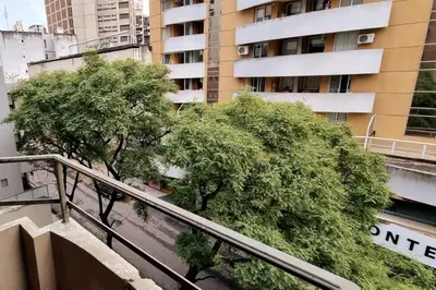 a stairway with trees in front of a building at Monoambiente en Nueva Cordoba in Cordoba