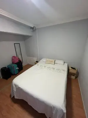 a bedroom with a large white bed in a room at La Casa de Petro in Cordoba