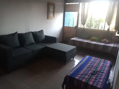 a living room with a couch and a coffee table at Colores de arguello in Cordoba
