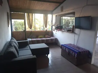 a living room with a couch and a tv at Colores de arguello in Cordoba