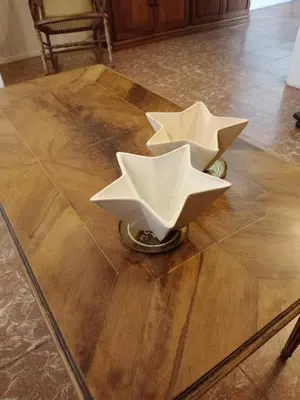 a table with two paper stars on top of it at Being in Cordoba