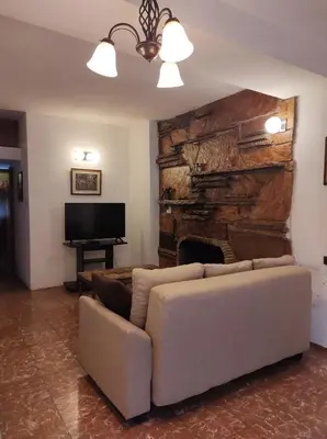 a living room with a couch and a fireplace at Being in Cordoba