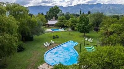 an aerial view of a swimming pool in a yard at Cabañas Ocho Soles in Las Rabonas