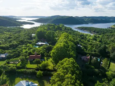 an aerial view of a river and a house at Cabañas Ocho Soles in Las Rabonas