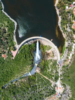 an aerial view of a waterfall in a river at Cabañas Ocho Soles in Las Rabonas
