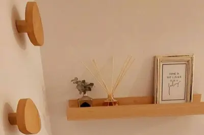 a shelf with a picture and some sticks on it at Excelente departamente nuevo! in Cordoba