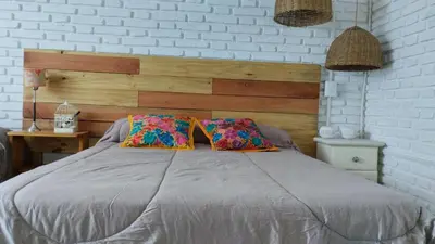 a bed with two pillows on it in a bedroom at Casa Olivia Habitación privada in Alta Gracia