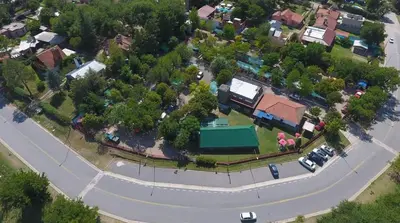 an overhead view of a road in a residential neighborhood at La Ribera Hotel Dormis Camping in Villa Carlos Paz