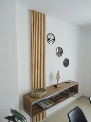 a living room with a console table and a chair at Hermoso Departamento confort y calidad in Cordoba