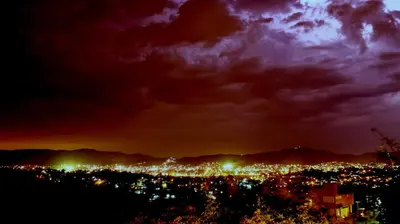 a view of a city at night at Alta Morada in Villa Carlos Paz