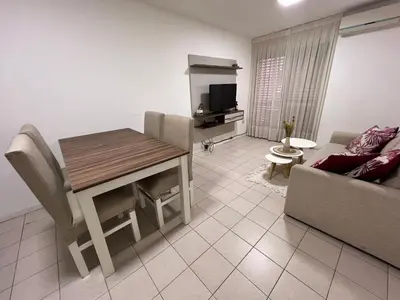 a living room with a table and a couch at Alojamiento Buen Pastor in Cordoba
