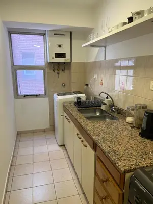 a kitchen with a sink and a counter top at Alojamiento Buen Pastor in Cordoba