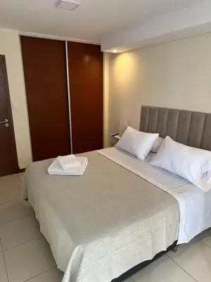 a bedroom with a large bed with two white pillows at San Lorenzo 490 - Nueva Córdoba in Cordoba