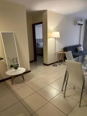 a living room with a couch and a table and chairs at San Lorenzo 490 - Nueva Córdoba in Cordoba