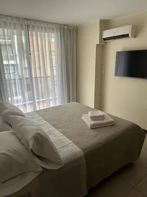 a bedroom with a bed with two towels on it at San Lorenzo 490 - Nueva Córdoba in Cordoba