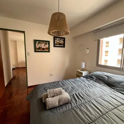 a bedroom with a bed with a towel on it at San Lorenzo 495 bis, Nueva Córdoba in Cordoba