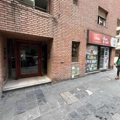 a store front of a brick building with a door at San Lorenzo 495 bis, Nueva Córdoba in Cordoba