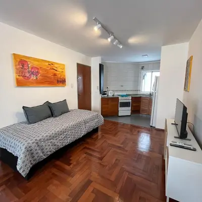 a bedroom with a bed and a television in it at San Lorenzo 495 bis, Nueva Córdoba in Cordoba