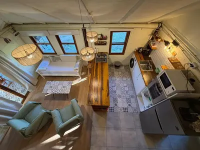 an overhead view of a living room and kitchen in a tiny house at Casa Playa Mansa in Mina Clavero
