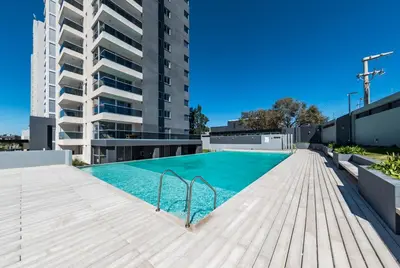 a swimming pool on the roof of a building at La Diva de Gama in Cordoba
