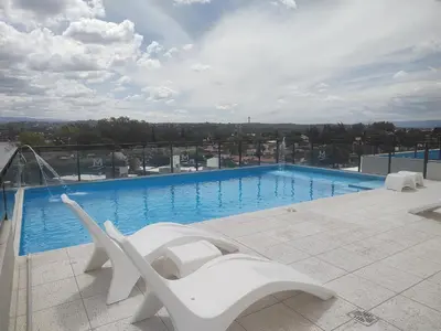 a large swimming pool on top of a building at Dpto en Carlos Paz con vista al Lago in Villa Carlos Paz