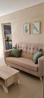 a living room with a couch and a coffee table at Vista al Kempes in Cordoba