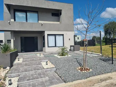 a house with a tree in front of it at La Palmerita !! in Cordoba