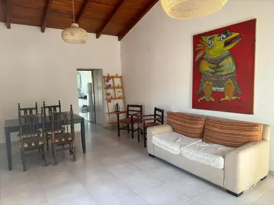 a living room with a couch and a table at Hermoso departamento en alquiler in Cordoba