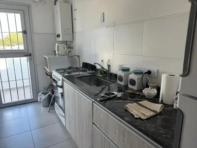 a kitchen with a sink and a counter top at Hermoso departamento en alquiler in Cordoba