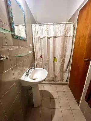 a bathroom with a sink and a shower at Depto 150 in Villa Carlos Paz