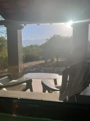 a patio with a table and a table and a chair at Casa en La Comarca in San Javier