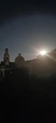 a building with a light on top of it at night at Dpto 1 RaGi in Cordoba
